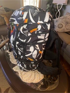 FARM Rio Black Toucan Pattern Backpack with Orange Beak Accents